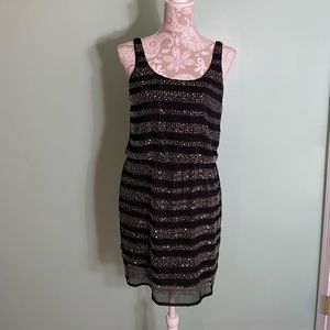 Beautiful mini black dress part wears with heavy hand stitched bead work.